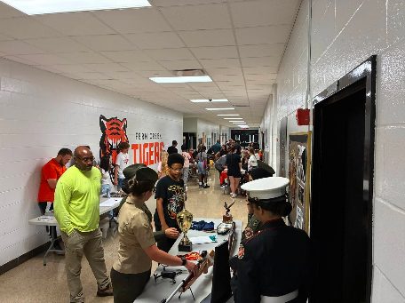 MCJROTC cadets at an information table in the Fern Creek High School hallway
